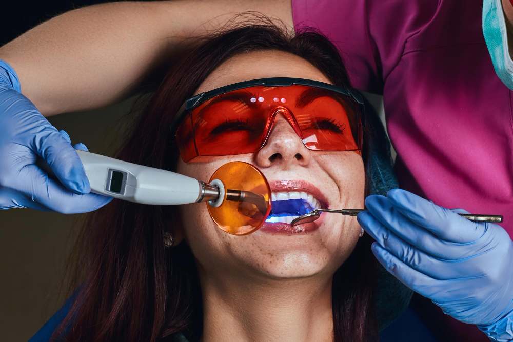 Female dentist treating a patient