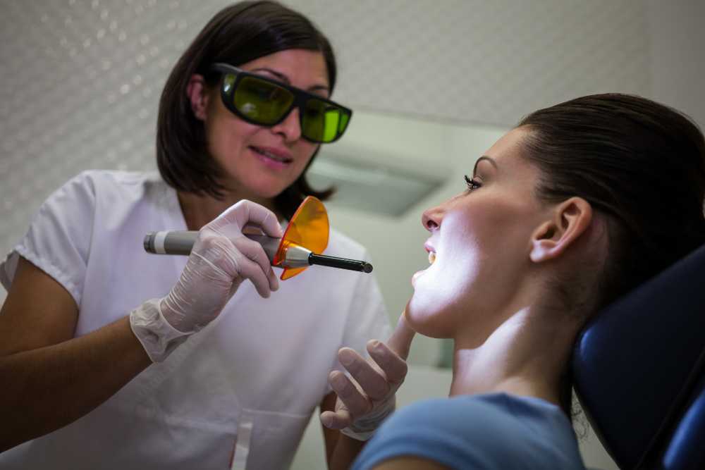 Dentist examining patients teeth