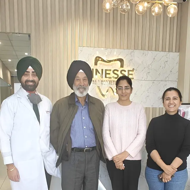 Col. Dalbir Singh with the Finesse Dental team after his dental implant treatment in Mohali