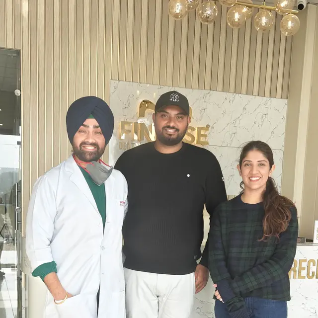 Iqbal Singh, visiting from Italy, with the Finesse Dental team after his dental implant treatment in Mohali